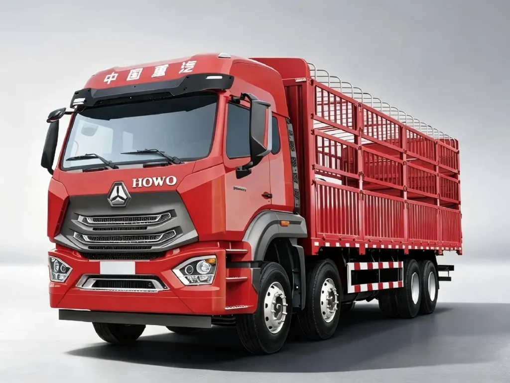 SINOTRUK HOWO NX 8X4 red stake cargo trucks in light grey gradient studio background, clear HOWO logo, large livestock/fence cargo body, heavy-duty 12-wheel freight lorry for agricultural and bulk goods transport in Africa, Latin America and Southeast Asia