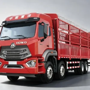 SINOTRUK HOWO NX 8X4 red stake cargo trucks in light grey gradient studio background, clear HOWO logo, large livestock/fence cargo body, heavy-duty 12-wheel freight lorry for agricultural and bulk goods transport in Africa, Latin America and Southeast Asia