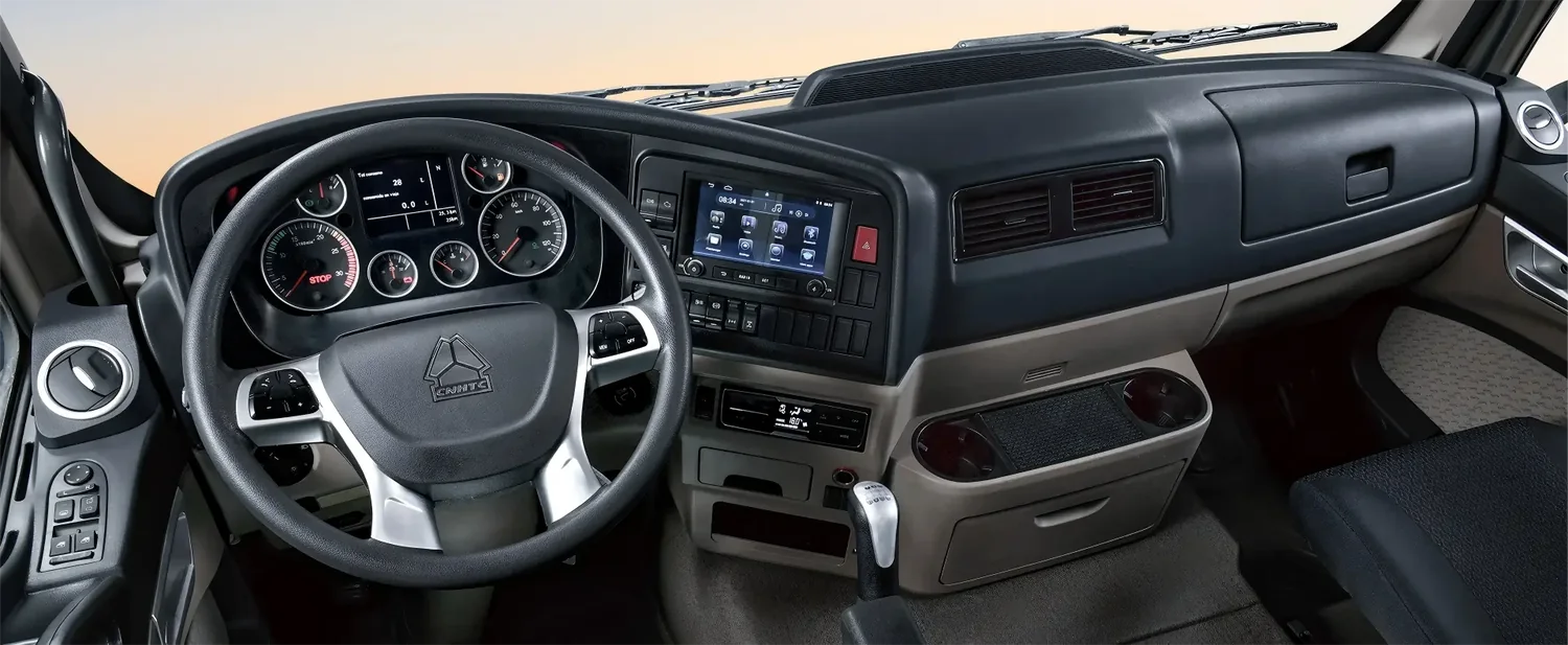 HOWO TX cab interior with dashboard and steering controls